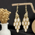 Elegant gold peacock drop earrings with white glitter feathers and crystal rhinestones - Gold Rhinestone White Tassel Peacock