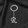 Polished silver stainless steel keychain featuring a capital letter R on black satin - Letter R
