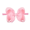 Pink nylon baby headband featuring a large textured bubble flower bow for infants - Pink