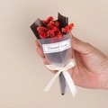 Close-up of a small bouquet of red dried flowers with a black wrap and Eternal love sticker - Style 02 Red Crystal Grass Bouquet