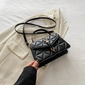 Minimalist black square crossbody bag with quilted triangle patterns and gold hardware - Black
