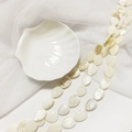 Natural white mother of pearl leaf beads on a ceramic shell plate with soft netting - 10*15 Leaf
