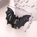 Black bat-shaped Halloween hair claw clip made of resin with 8.5cm size dimensions - Classic Black