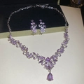 Detail of silver necklace and earrings set featuring purple gems and floral leaf patterns - Necklace-Purple (2-Piece Set) / Purple