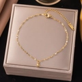 Fashionable gold beaded stainless steel anklet for women shown on a jewelry box - JLB5010 Small Gold Beads