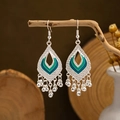 Macro detail of bohemian silver earrings with teal enamel and metallic tassels - Hollow Tear-drop Blue/Green Enamel Ball Tassel Style (E2871-22)