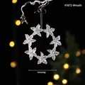 Glittery snowflake Christmas wreath ornament with pearlescent finish, 14cm diameter - Flower Garland