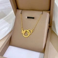 Gold titanium steel necklace featuring double rings and a textured butterfly pendant - Double Ring Butterfly Combo Gold (N133)