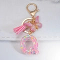 Pink glitter resin letter Q keychain with butterfly pendant and pink tassel - Letter Q
