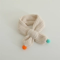 Detail of baby knitted scarf with soft pompom decorations and vertical ribbed texture - Colorful Pom Pom Style / 60-80cm / Beige