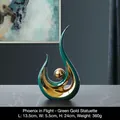 Modern abstract ceramic sculpture in peacock green and gold finish for shelf decor - Phoenix Flight - Green Gold Short
