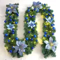 Detail of 2.7m Christmas garland with blue flowers and warm LED lights on pine needles - Premium Pre-lit Style / Blue