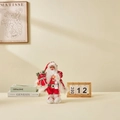 Standing Santa Claus doll in red sequined outfit holding a gift bag and vintage lamp - 30cm