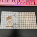 Detail of self-sealing bags with brown checkered pattern and cartoon happy puppy design - Happy Puppy