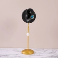 Blue oval gemstone and pearl drop earrings on a golden stand with professional display - Left Ear Black