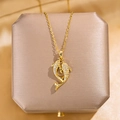 Collier de luxe en titane plaqué or 18 carats avec pendentif double dauphin étincelant - Collier Doré (avec Chaîne)
