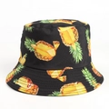 Close-up of tropical pineapple print on black reversible canvas fisherman sun hat - M (56-58cm) / Black