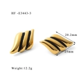 Detail of gold-tone geometric angel wing earrings with black drip oil and zirconia stones - Black Gold Stripe