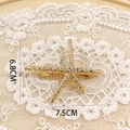 Detail shot of golden starfish hair accessory with 7.5cm width and 6.8cm height dimensions - Starfish Spring Clip