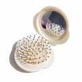 Portable beige shell-shaped folding hairbrush with integrated mirror and round bristles - Beige Cloud Folding Hairbrush