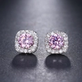 Macro detail of square pink zircon stud earrings with sparkling round center stone - Pink