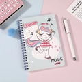 Detail view of unicorn spiral notebook with light blue cover and decorative pompom - Blue Unicorn