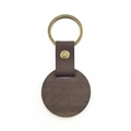 Detail of round walnut wood keychain with brown leather strap and brass ring buckle - Round Walnut Wood