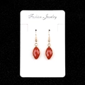 Elegantes pendientes dorados con piedras semipreciosas rojas facetadas de corte marquesa - Jaspe Rojo