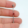 G23 titanium industrial barbell earring with a centered red zircon stone detail - Red Zirconia