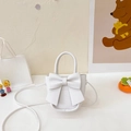 Mini white crossbody bag with large bow detail and elegant top handle for women - White