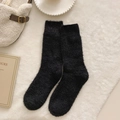 Thick black plush crew socks made of soft coral fleece for winter warmth and home comfort - One Size / Black