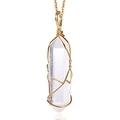 Detail of hand-wrapped hexagonal clear crystal pendant with gold wire on chain - White Crystal