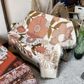 Bohemian floral cotton throw blanket with fringe edge draped on a camping chair - XT2022-1 Retro Warm Floral