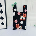 Black knit tote bag featuring colorful polka dots and cute red fox pattern - Polka Dot Puppy Black