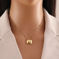 Polished gold initial m letter pendant on delicate beaded chain necklace for women - Letter M