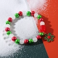 Christmas beaded bracelet with red, green, and white beads plus a green snowflake charm - Christmas Snowflake Charm Red Green White