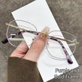 Montatura ottica poligonale oro e viola con terminali delle aste tartarugati alla moda - Montatura Viola Oro