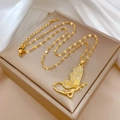 Detail of gold butterfly pendant with rhinestones on a silk background in a jewelry box - Butterfly Fairy Style (G130)