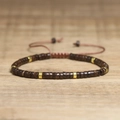 Adjustable woven bracelet with brown coconut shell beads and golden spacers - No.77 Coconut Shell