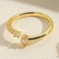 Macro shot of gold adjustable ring featuring marquise and square cut cubic zirconia gems - Adjustable Open / Marquise White Zirconia