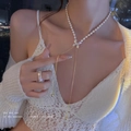 Golden pearl necklace featuring a diamond-set bow pendant and matching sparkling ring - Adjustable Long Tassel Butterfly Pearl Necklace