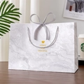 Elegant grey marble gift bag with satin bow and gold foil typography - Grey White Heart Marble
