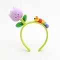 Detail of plush tulip and caterpillar decorations on a soft green headband for girls - Tulip Purple