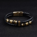 Detail view of black woven leather men's double-layer bracelet with golden magnetic clasp - Gold