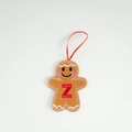 Brown gingerbread man felt ornament featuring a red embroidered letter Z and red ribbon - Letter Z