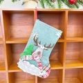 Blue cloth Christmas stocking with 3D reindeer and tree hanging on a wooden rack - Linen Fence Medium Stocking (Reindeer Style)