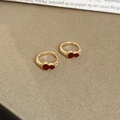 Detailed macro view of gold-plated gourd earrings with red enamel and zircon accents - Gold Plated Copper / Enamel / Zirconia / Red Gourd Ear Clip Style (6155173246312) / Red & Gold