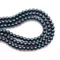 Detailed view of iridescent black round beads in a multi-layer coiled strand - Iridescent Black