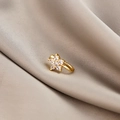 Macro shot of gold-plated flower non-pierced nose clip with sparkling cubic zirconia - Five-Petal Flower (E5689-7)