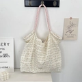 Detail of floral chiffon tote bag featuring woven pink straps and Sozakka woven label - Jacquard Yellow Cherry